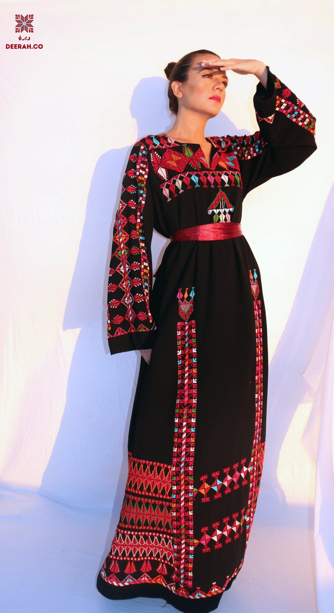 geometric embroidered dress A luxurious burgundy dress adorned with geometric embroidery