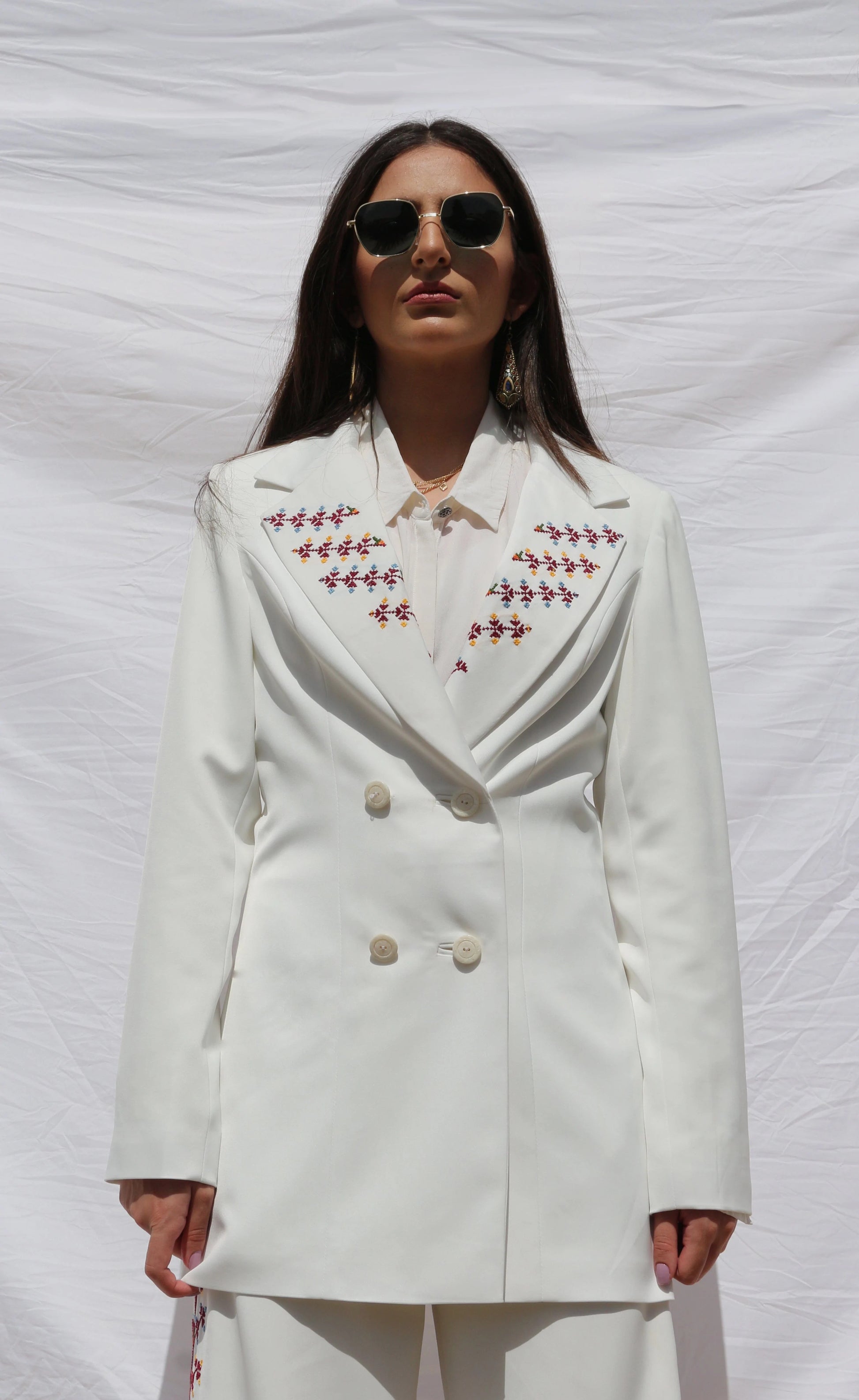 https://deerah.co/cdn/shop/products/hand-embroidered-custom-made-women-pant-suit-in-pearl-white-deerah-39975101661417.webp?v=1672898146&width=1946